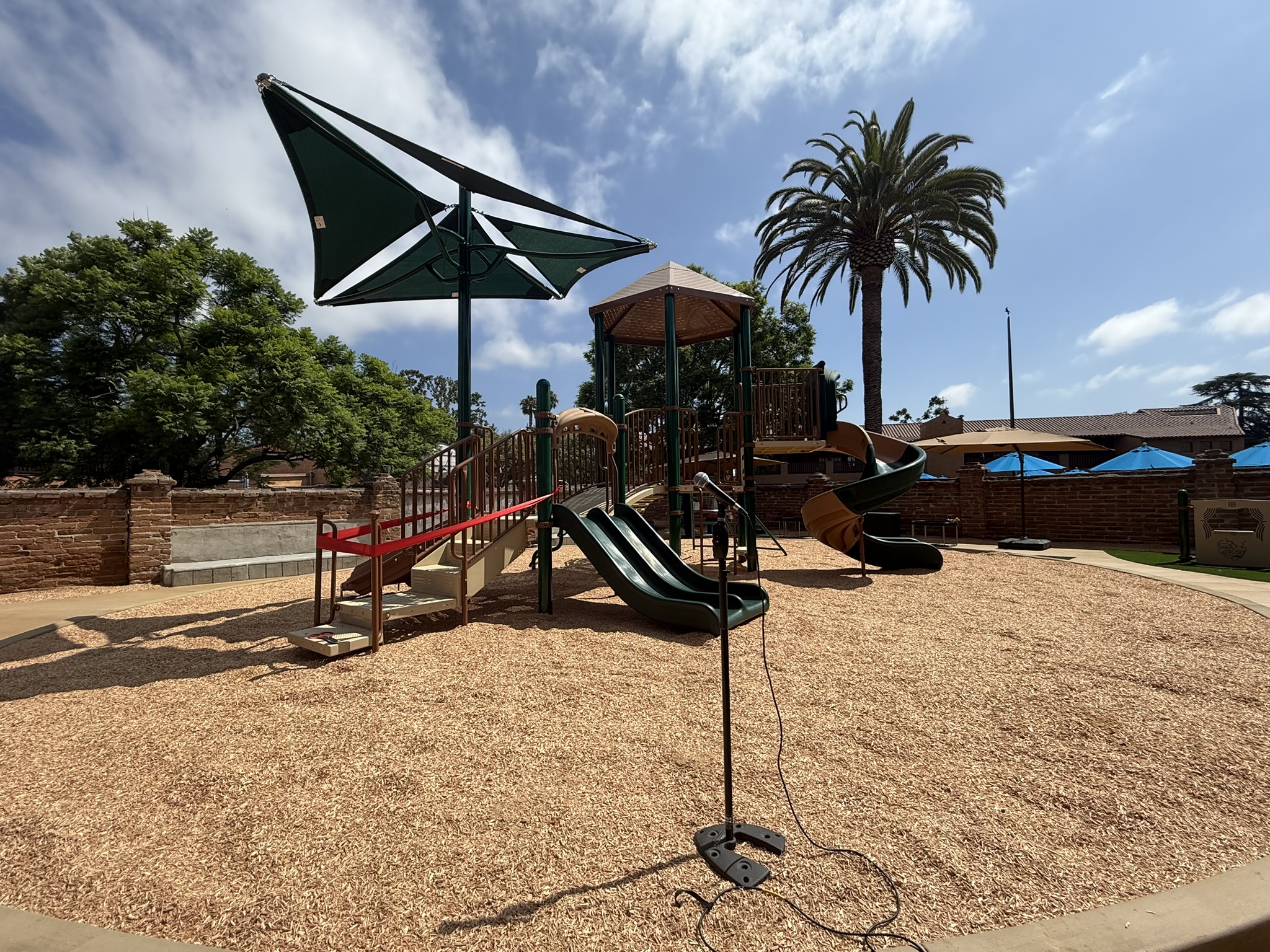 This image showcases the newly completed playground at Mission Basilica in San Juan Capistrano, designed with Engineered Wood Fiber (EWF) surfacing to provide a safe, accessible, and eco-friendly play area for children and families in the community.